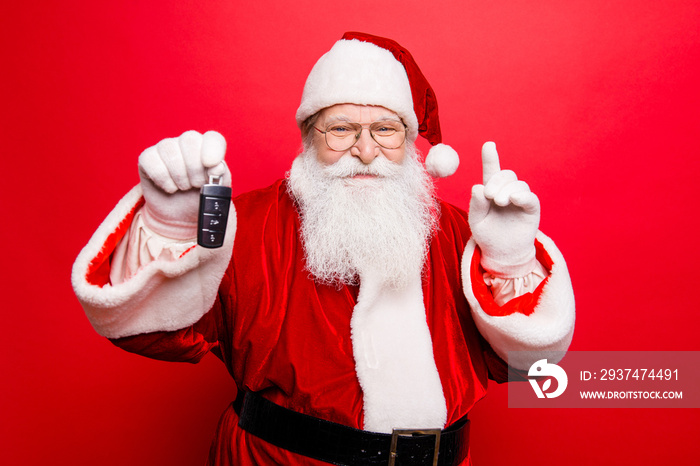 Funny aged grandfather in red traditional outfit and headwear. X mas noel surprise time! Success, ha