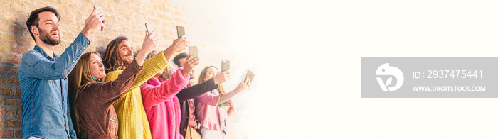 Group of young people using smartphones making selfie. Concept of new technology. horizontal web ban