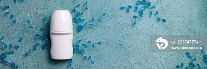 Flat lay composition with deodorant on blue background. Beauty, hygiene, cosmetics concept. Top view