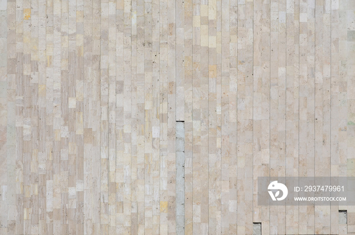 Background texture of old beige marble wall from a variety of large tiles