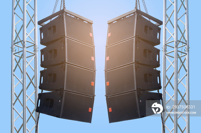 Black speaker hanging on a stand / Sound System in concert. Clipping path.