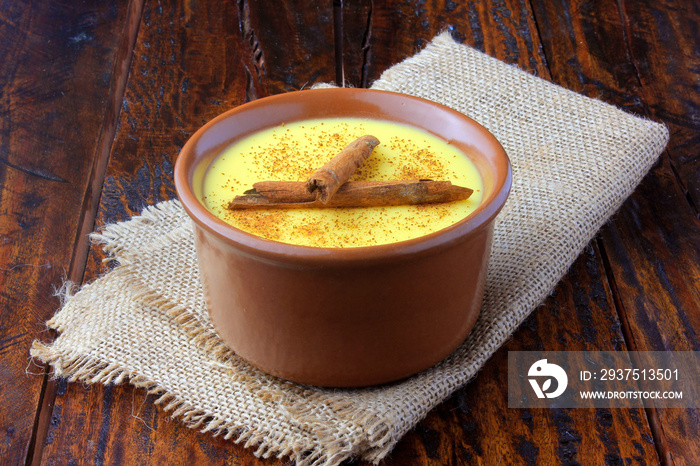 Curau, cream of corn sweet and dessert typical of the Brazilian cuisine, with cinnamon placed in cer