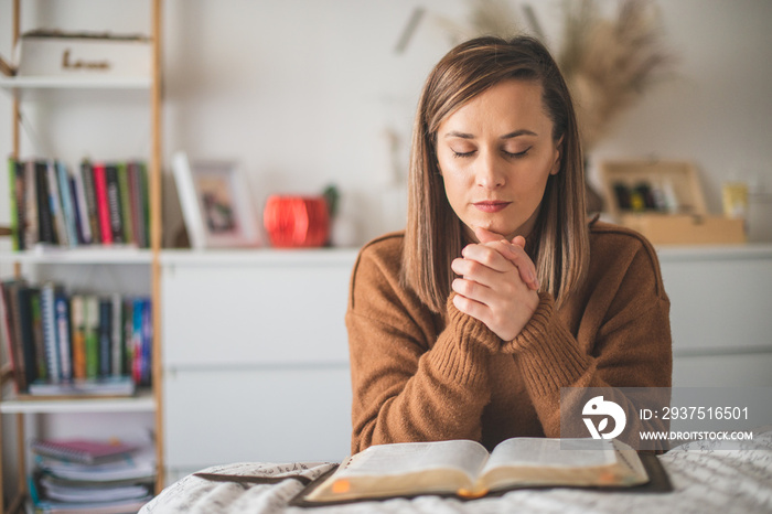 Woman with pray and worship god in her bedroom