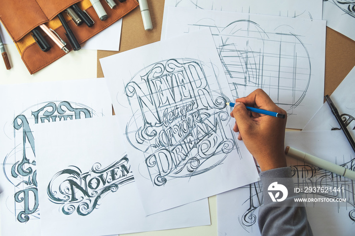 Typography Calligraphy artist designer drawing sketch writes letting spelled pen brush ink paper tab