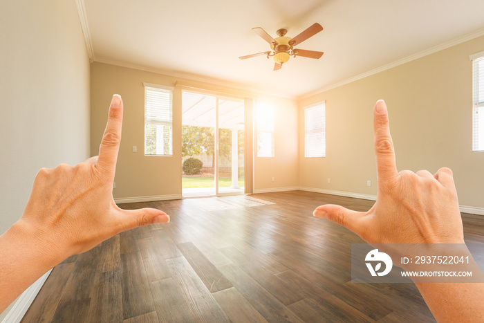 Female Hands Framing Empty Room of House