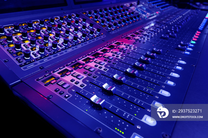 Professional audio studio sound mixer console board panel with recording , faders and adjusting knob
