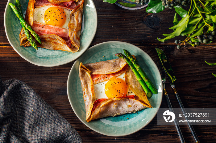 Galette,French food buckwheat pancake,with egg in plate. Healthy food concept image.