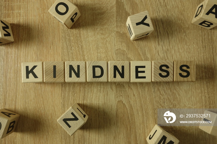 Kindness word from wooden blocks on desk