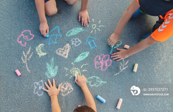 Childrens drawings on the asphalt with chalk. Selective focus.