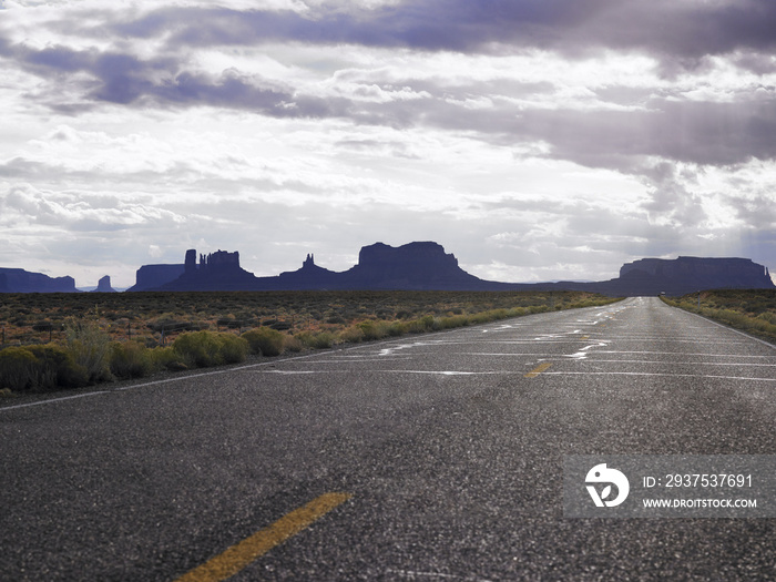 Two Lane Road Through Desert Countryside