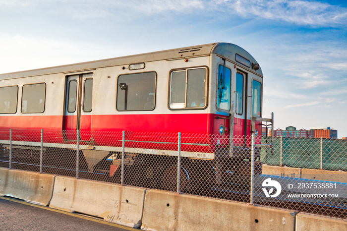 Boston MBTA subway lines, train crossing Longfellow bridge over scenic Charles river