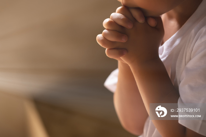 Asian boy praying in the morning