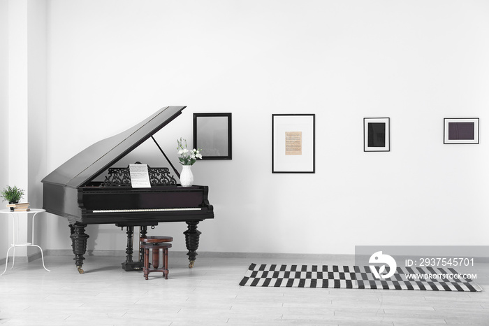 Black grand piano in interior of room