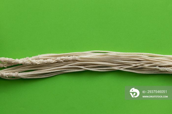 Tallit threads made of sheep wool, green background