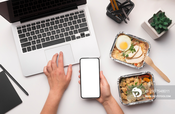 Woman making online order of healthy food by cellphone