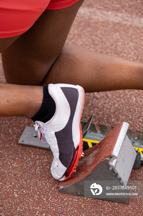 Close-up�of female runners foot on starting block