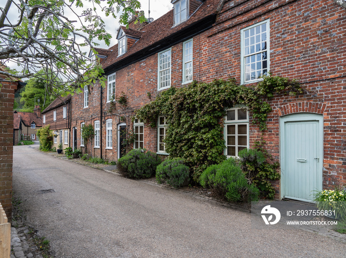 Pretty street of brick houses in village of Hambleden