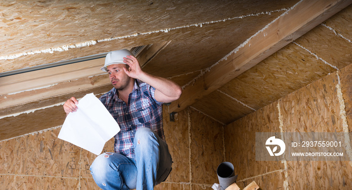 Builder Reading Plans Inside Unfinished Home