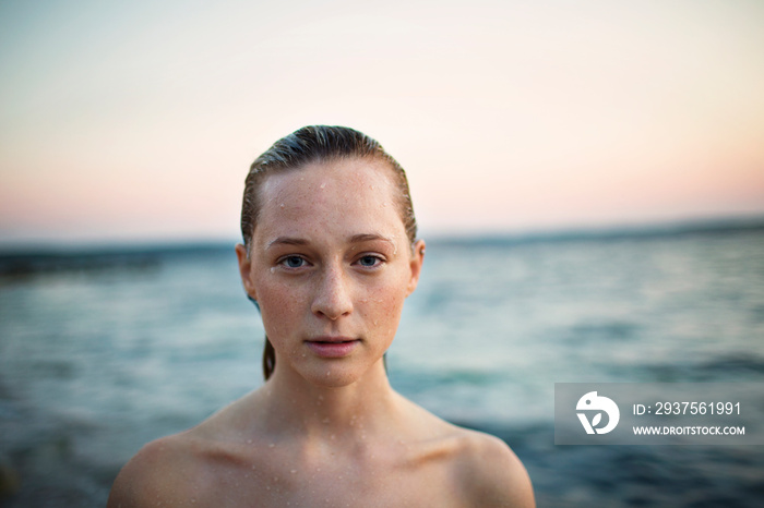 Portrait of woman standing against sky