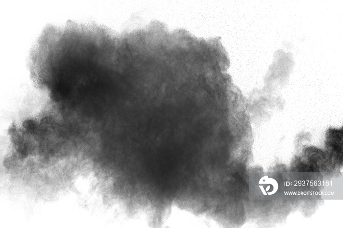 Black powder explosion against white background. Black dust particles splashing.