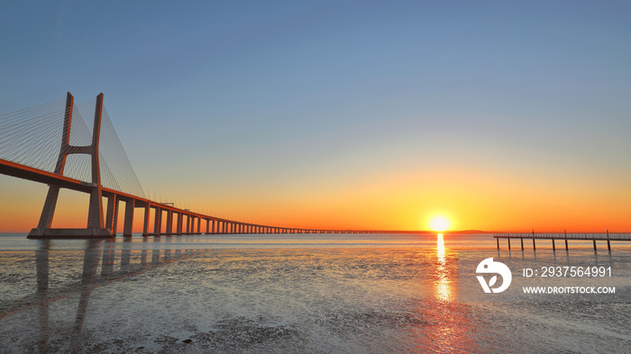 Sunrise at the Vasco de Gama bridge over the Tagus river, Lisbon Portugal