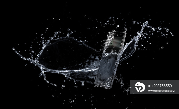 Smartphone with splashing of water or explosion flying in the air isolated on black background