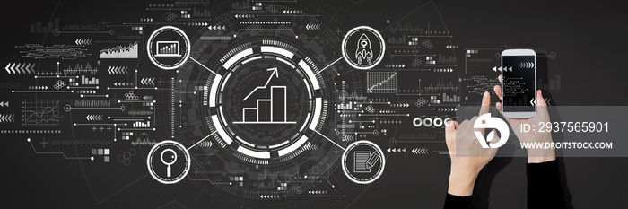 Business growth analysis with person using a white smartphone