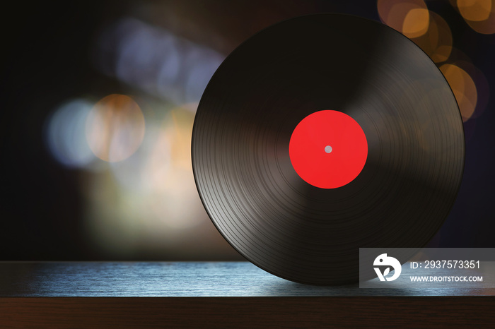 Vinyl disc on the table with abstract background