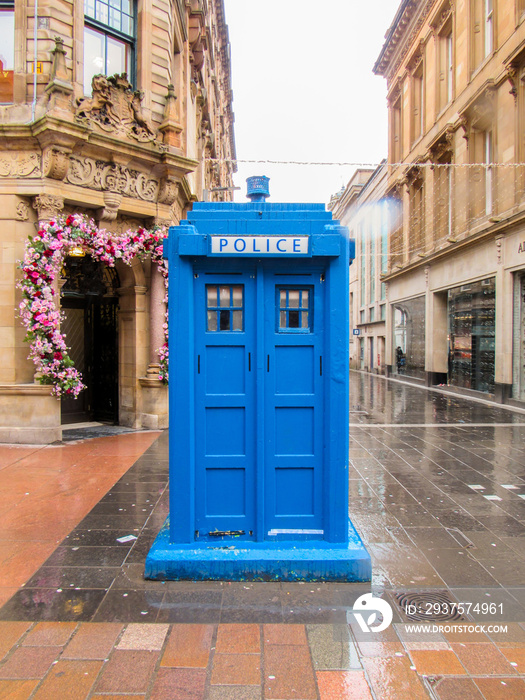 Street with blue police box in Glasgow, United Kingdom