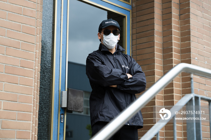 Security Guard Standing In Face Mask