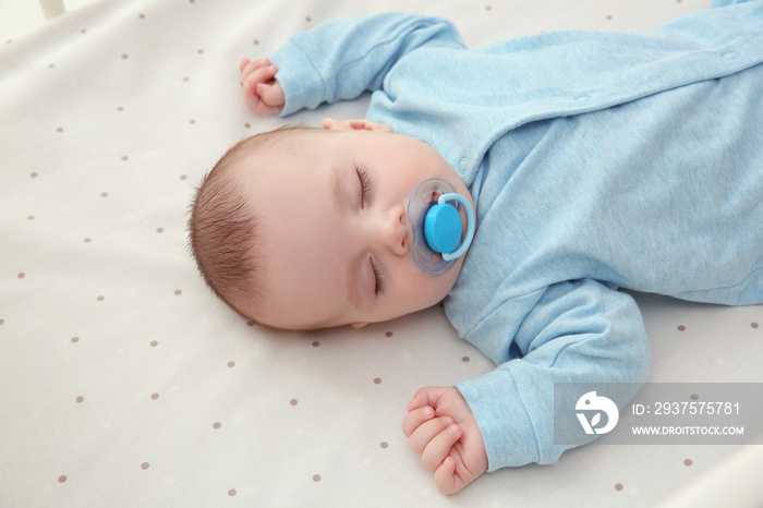 Cute little baby sleeping in cradle at home