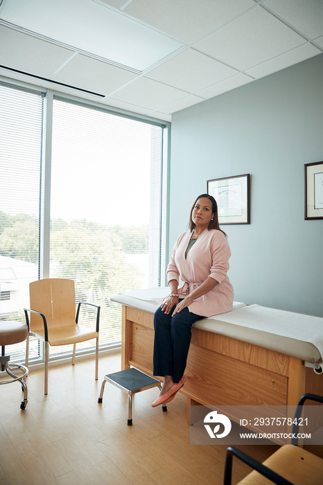 Woman waiting in examination room