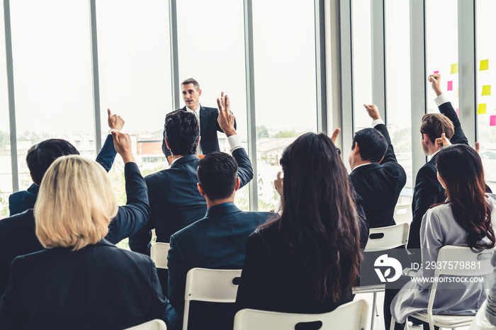 Group of business people meeting in a seminar conference . Audience listening to instructor in emplo