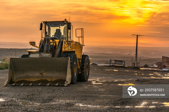 Excavator at the end of a working day in a construction site