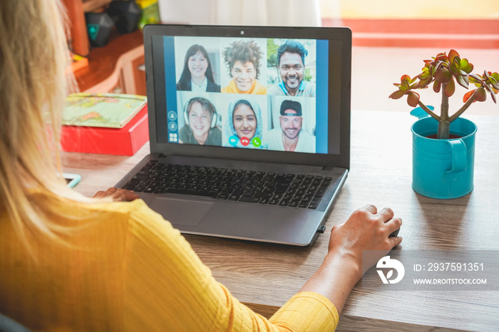 Young woman having a video call with multiracial friends during isolation quarantine - Group of youn