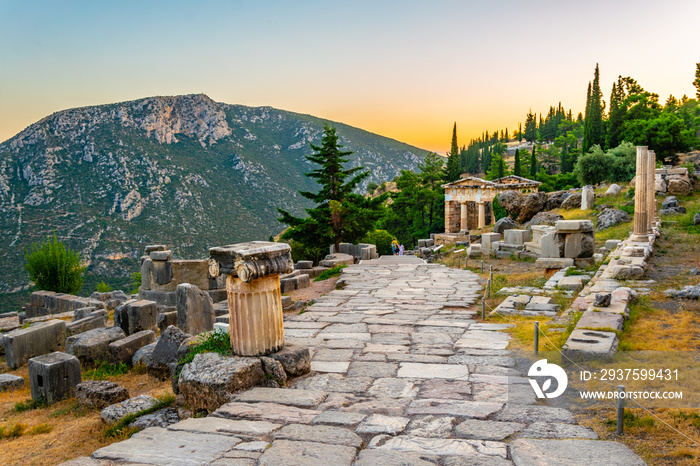 Sunset view of Athenian treasury at the ancient delphi site in Greece