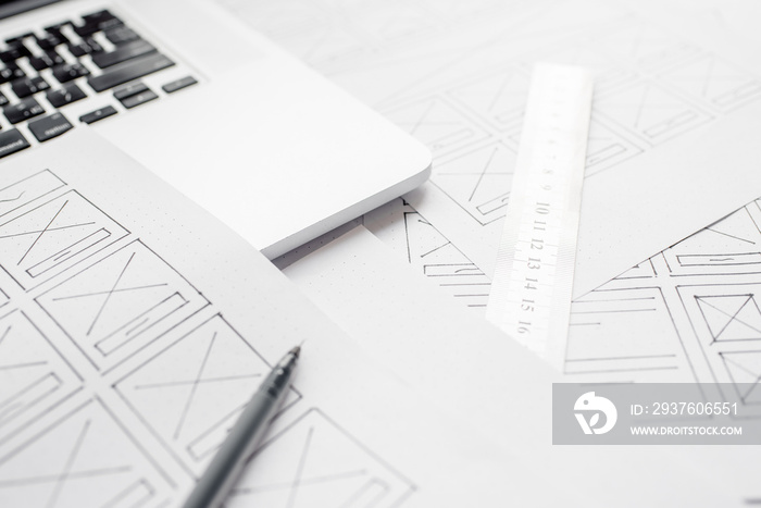 UX website designer drawing wireframe sketch of prototype, framework, layout future project. Creativ