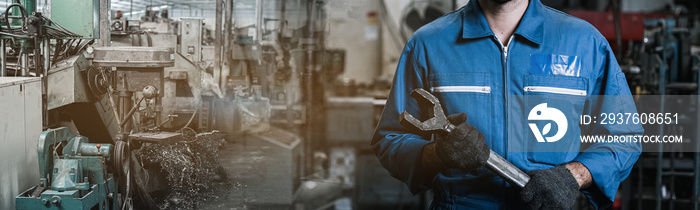Close up image engineer men wearing uniform safety and holding wrench tool in factory background. ba