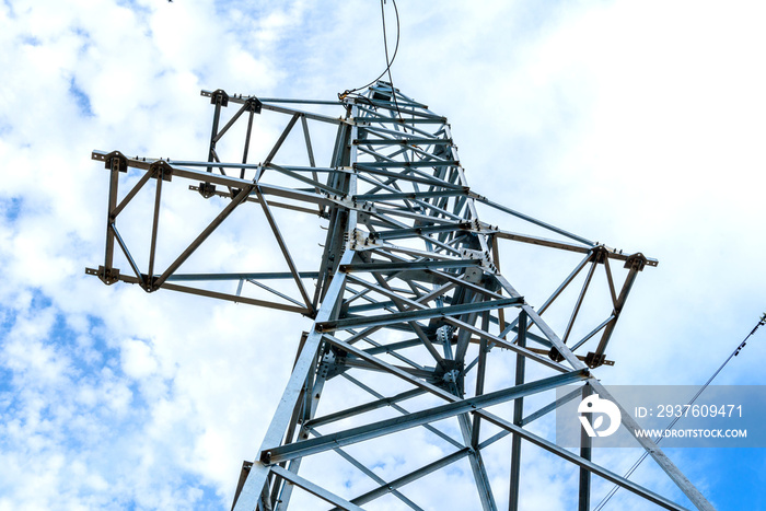 High voltage electric pillar from under. A high-voltage electricity tower