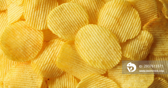 crispy potato chips snack texture background closeup top view