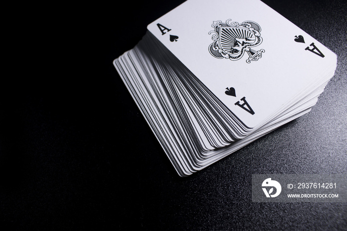 poker card stack deck on dark black background