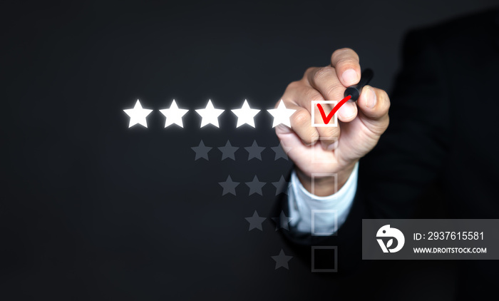 Businessman putting check mark a checkbox on five star rating. Increase rating company or ranking, e