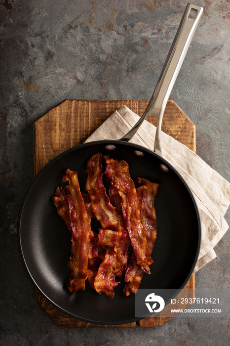 Cooked bacon on a skillet