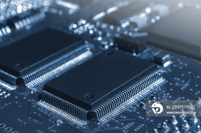 Closeup of Printed Circuit Board with processor, integrated circuits and many other surface mounted 