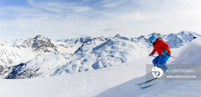 Ski in winter season, mountains and ski touring man on the top in sunny day in France, Alps above th