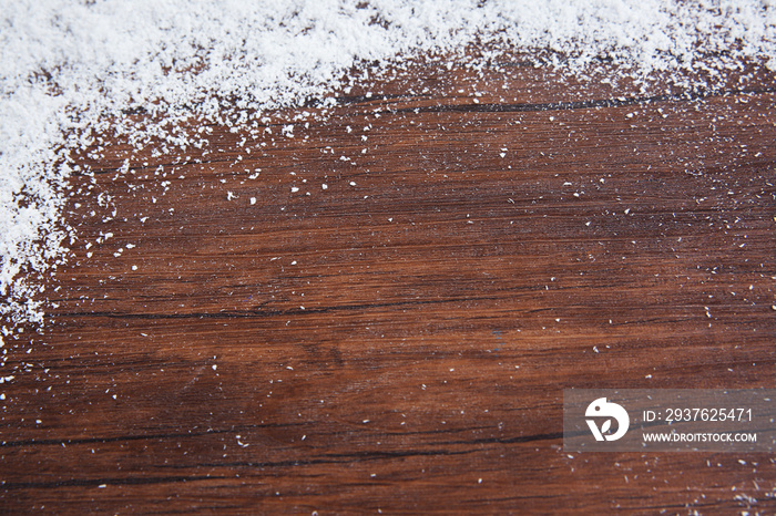 Snowy brown wooden background