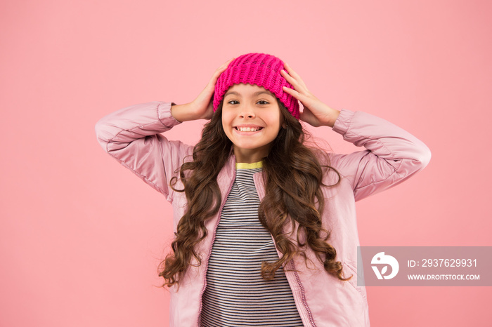 wear warm clothes in cold season. winter holiday activity. little beauty pink background. kid fashio