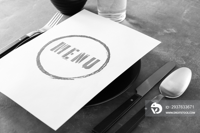 Menu on served table in restaurant