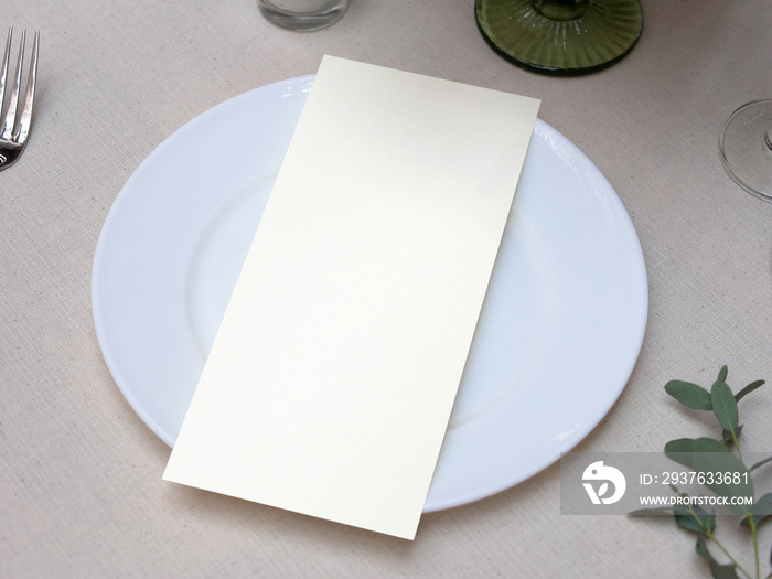 Mockup white blank space card, for Menu, Flyer, greeting, invitation on wedding table setting backgr