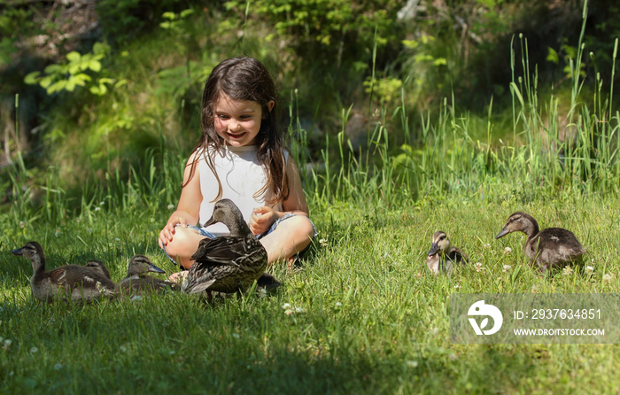 little child playing with duck